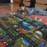 Žaidimų kilimėlis su miesto vaizdais photo review